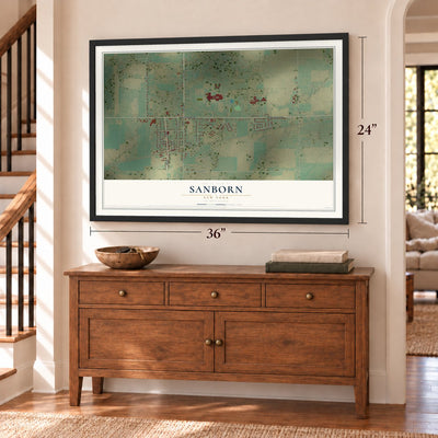 Sanborn, New York map, 24 x 36 inch print in a black frame above a dresser by a staircase