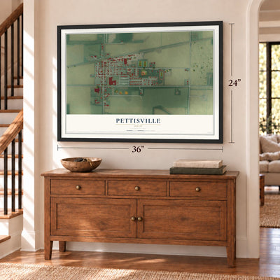 Pettisville, Ohio map, 24 x 36 inch print in a black frame above a dresser by a staircase