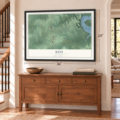 Keys, Oklahoma map, 24 x 36 inch print in a black frame above a dresser by a staircase