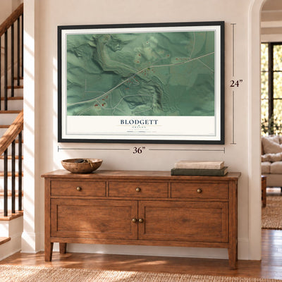 Blodgett, Oregon map, 24 x 36 inch print in a black frame above a dresser by a staircase