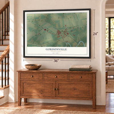 Gordonville, Pennsylvania map, 24 x 36 inch print in a black frame above a dresser by a staircase