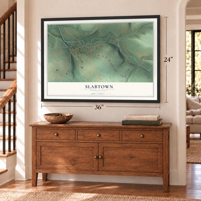 Slabtown, Pennsylvania map, 24 x 36 inch print in a black frame above a dresser by a staircase