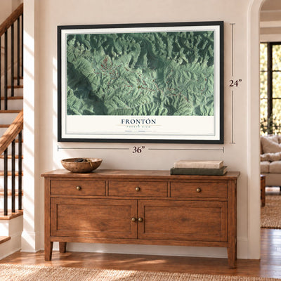 Frontón, Puerto Rico map, 24 x 36 inch print in a black frame above a dresser by a staircase