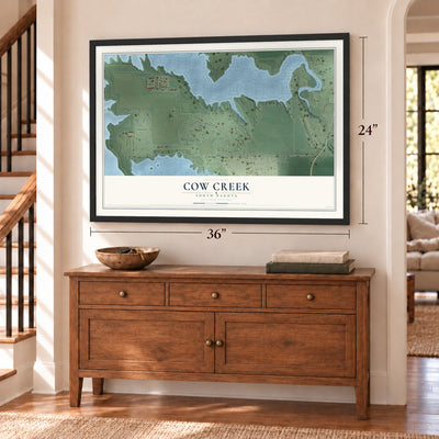 Cow Creek, South Dakota map, 24 x 36 inch print in a black frame above a dresser by a staircase
