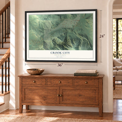 Crook City, South Dakota map, 24 x 36 inch print in a black frame above a dresser by a staircase