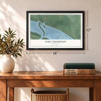 Fort Thompson, South Dakota map, 12 x 18 inch print in a black frame in an entryway