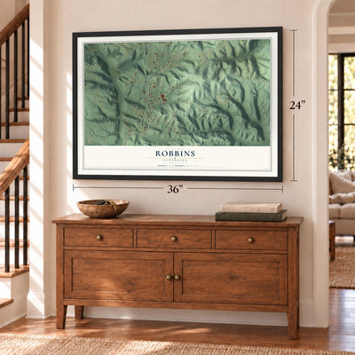 Robbins, Tennessee map, 24 x 36 inch print in a black frame above a dresser by a staircase