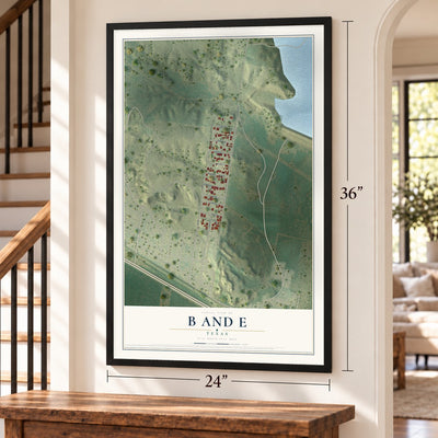 B and E, Texas map, 24 x 36 inch print in a black frame by a staircase