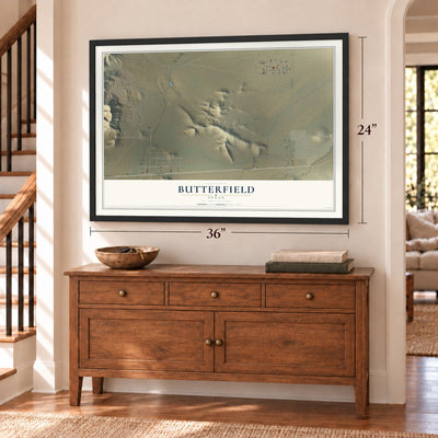 Butterfield, Texas map, 24 x 36 inch print in a black frame above a dresser by a staircase