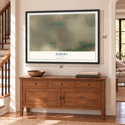 Elbert, Texas map, 24 x 36 inch print in a black frame above a dresser by a staircase