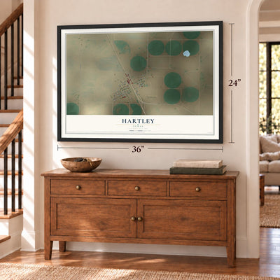 Hartley, Texas map, 24 x 36 inch print in a black frame above a dresser by a staircase