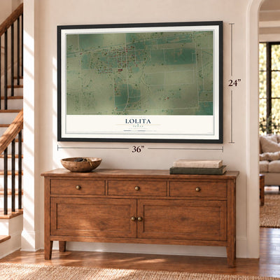 Lolita, Texas map, 24 x 36 inch print in a black frame above a dresser by a staircase
