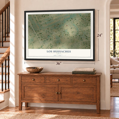 Los Huisaches, Texas map, 24 x 36 inch print in a black frame above a dresser by a staircase