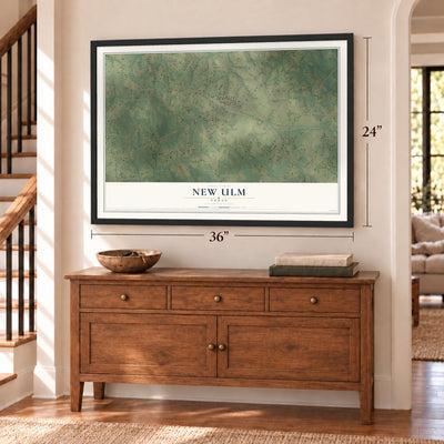 New Ulm, Texas map, 24 x 36 inch print in a black frame above a dresser by a staircase