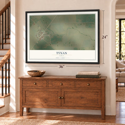 Tynan, Texas map, 24 x 36 inch print in a black frame above a dresser by a staircase