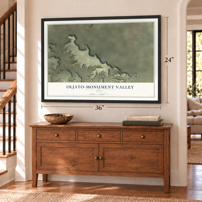 Oljato-Monument Valley, Utah map, 24 x 36 inch print in a black frame above a dresser by a staircase