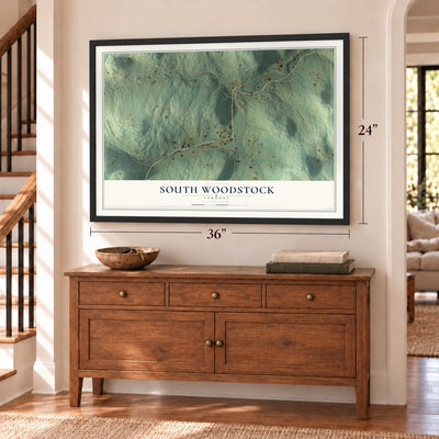 South Woodstock, Vermont map, 24 x 36 inch print in a black frame above a dresser by a staircase