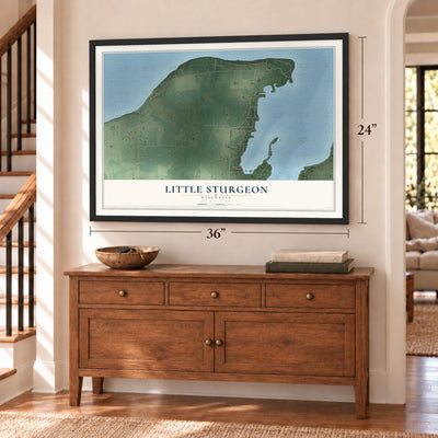 Little Sturgeon, Wisconsin map, 24 x 36 inch print in a black frame above a dresser by a staircase