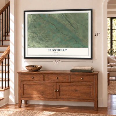 Crowheart, Wyoming map, 24 x 36 inch print in a black frame above a dresser by a staircase