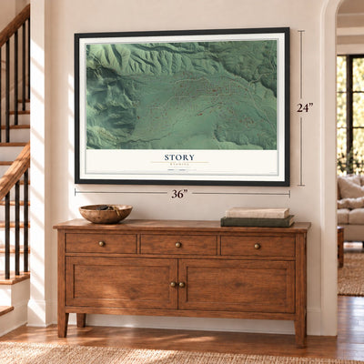 Story, Wyoming map, 24 x 36 inch print in a black frame above a dresser by a staircase