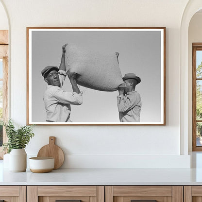 Laborers Lifting Rice Bag in Crowley Louisiana 1938 - Available at KNOWOL