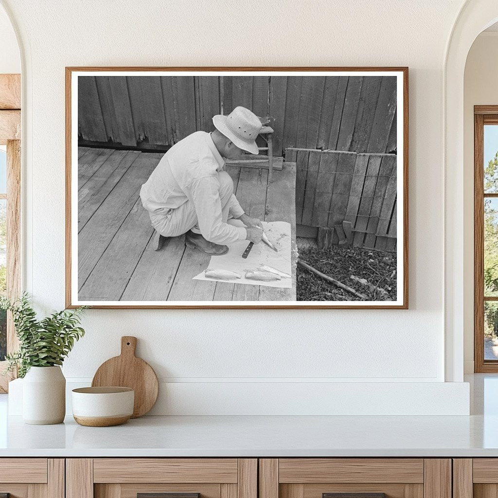 Man Cleaning Fish in Olga Louisiana September 1938 - Available at KNOWOL