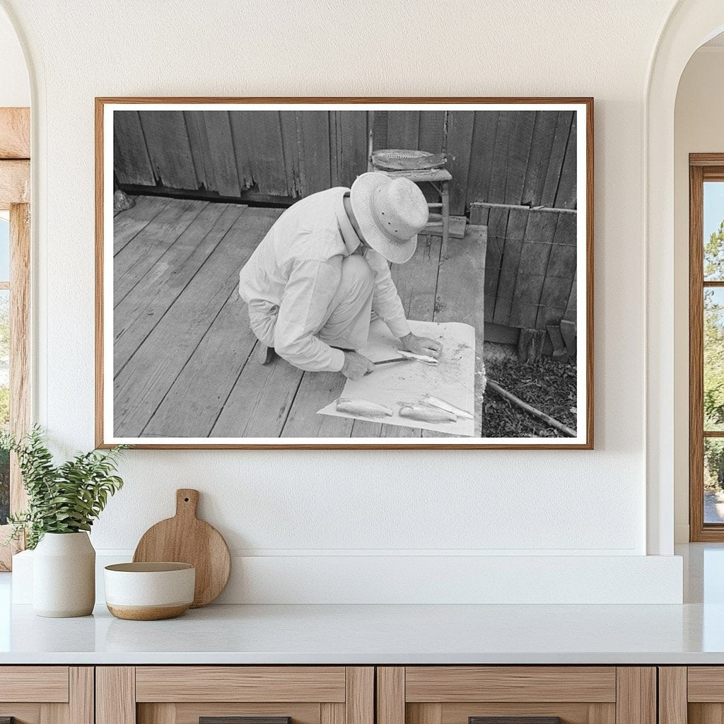 Man Cleaning Fish on Waterfront Olga Louisiana September 1938 - Available at KNOWOL