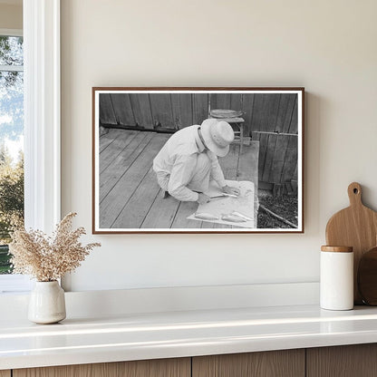 Man Cleaning Fish on Waterfront Olga Louisiana September 1938 - Available at KNOWOL