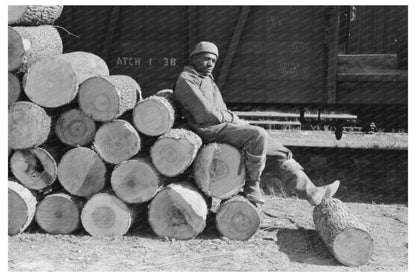 Man Resting on Logs Eudora Arkansas January 1939 - Available at KNOWOL