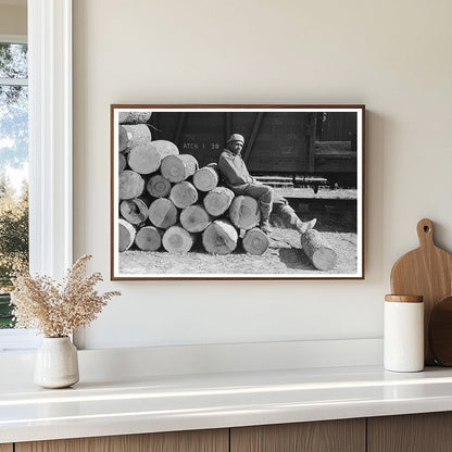 Man Resting on Logs Eudora Arkansas January 1939 - Available at KNOWOL