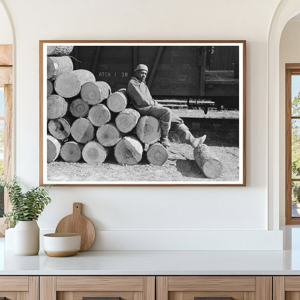 Man Resting on Logs Eudora Arkansas January 1939 - Available at KNOWOL