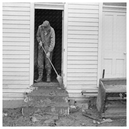 Man Sweeping Mud from Steps in Posey County Indiana 1937 - Available at KNOWOL