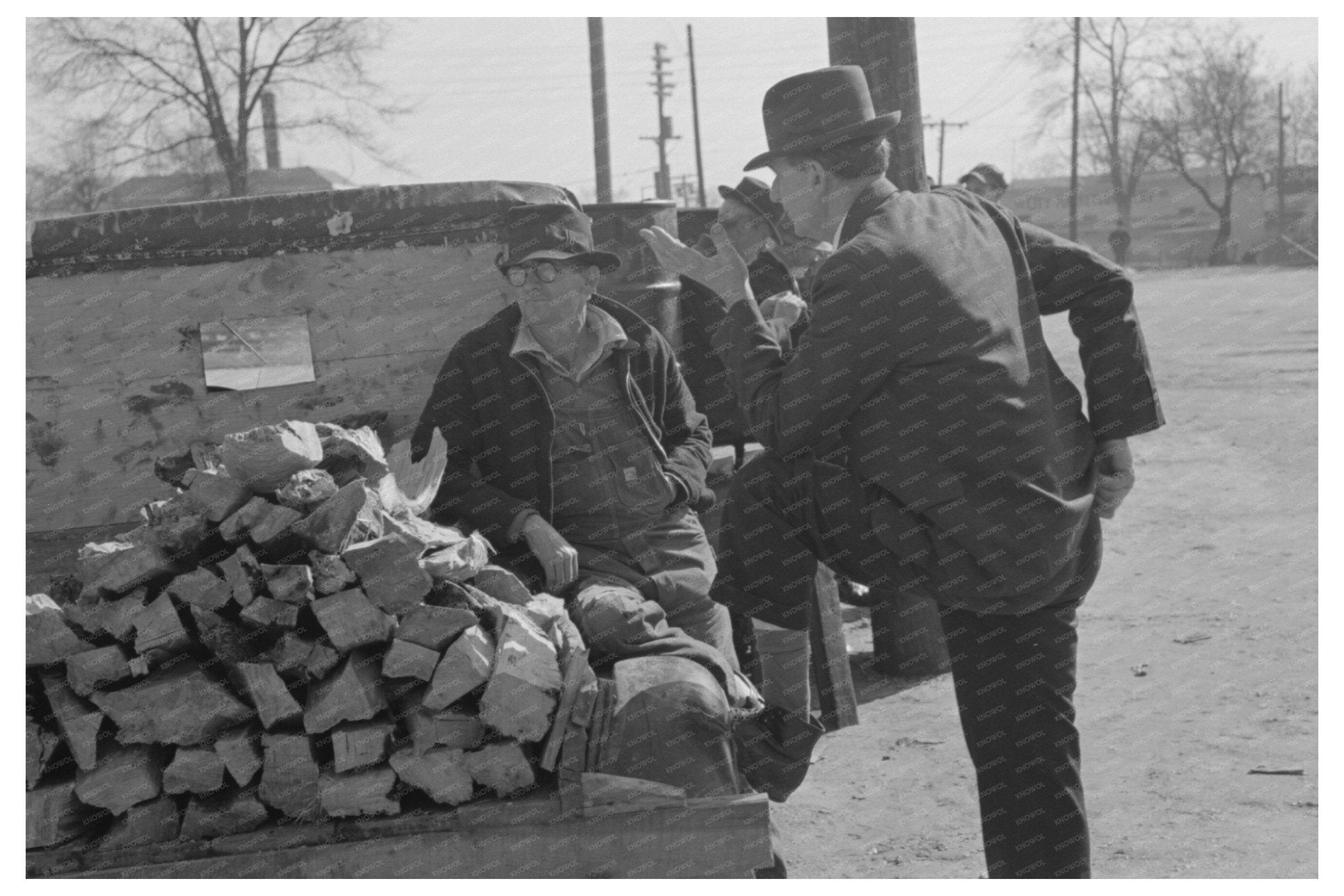 Man Talks to Farmer by Truck of Wood Laurel Mississippi 1939 - Available at KNOWOL