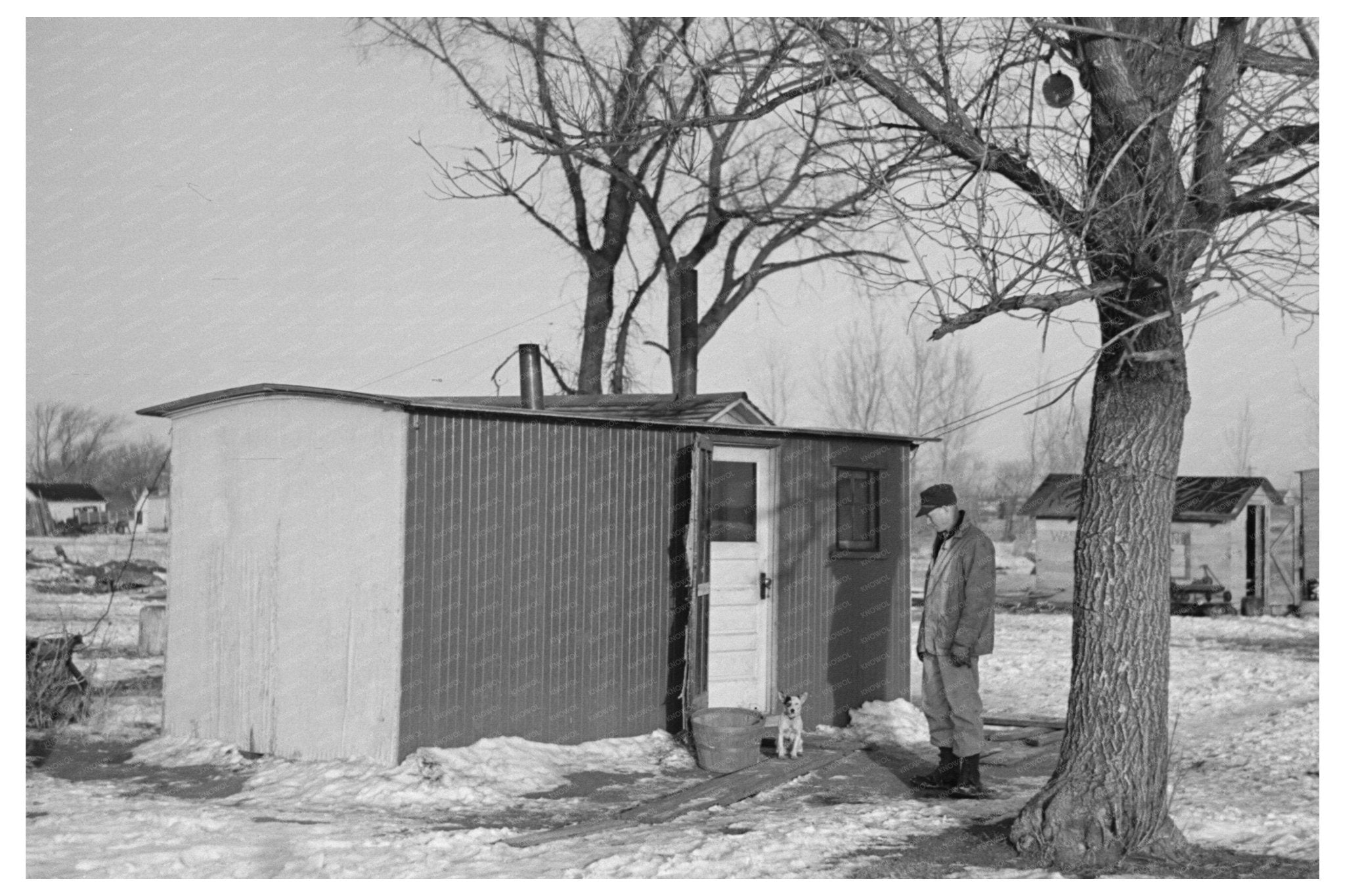 Marcus Miller in Front of Shack Spencer Iowa December 1936 - Available at KNOWOL