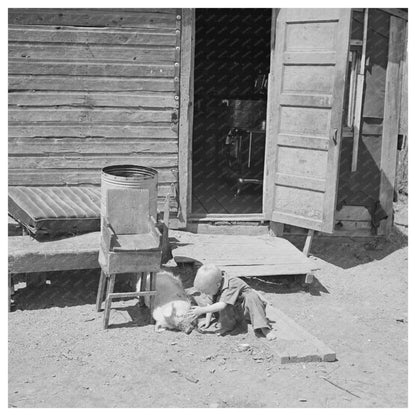 Mathews child playing with pig in Gibbs City 1937 - Available at KNOWOL