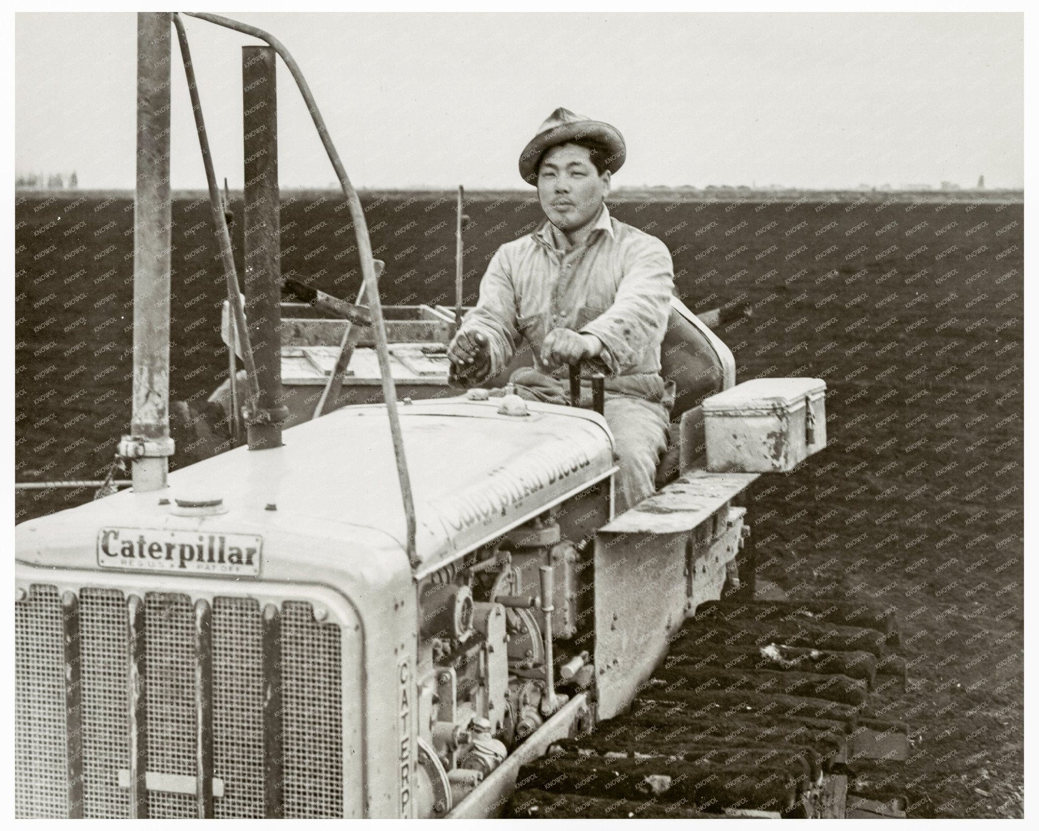 Maurice Shinmoto on Caterpillar Tractor in 1942 - Available at KNOWOL