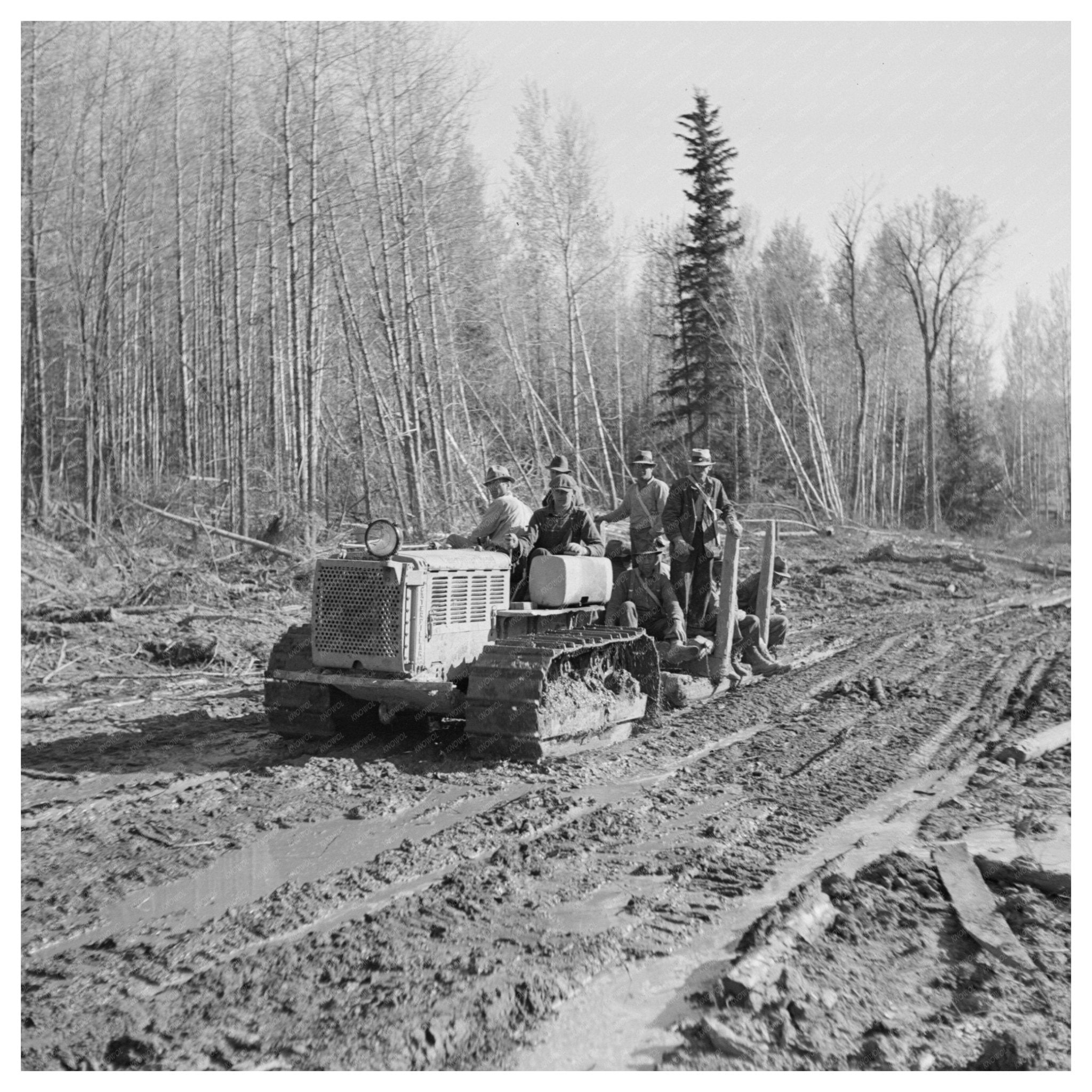 Men Riding Tractor from Lumber Camps Minnesota June 1937 - Available at KNOWOL