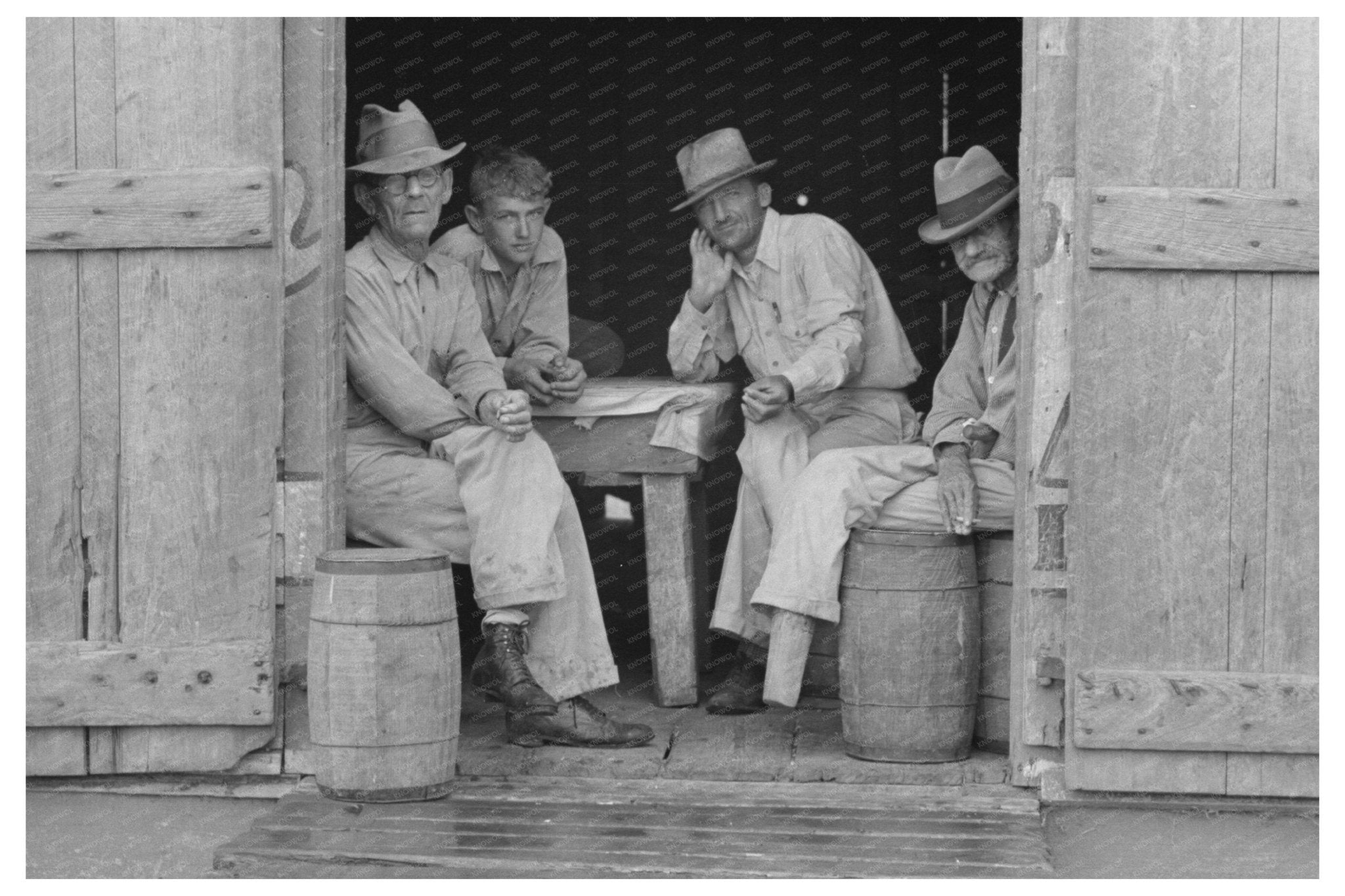 Men Seeking Shelter in Rustic Shack Norco Louisiana 1938 - Available at KNOWOL