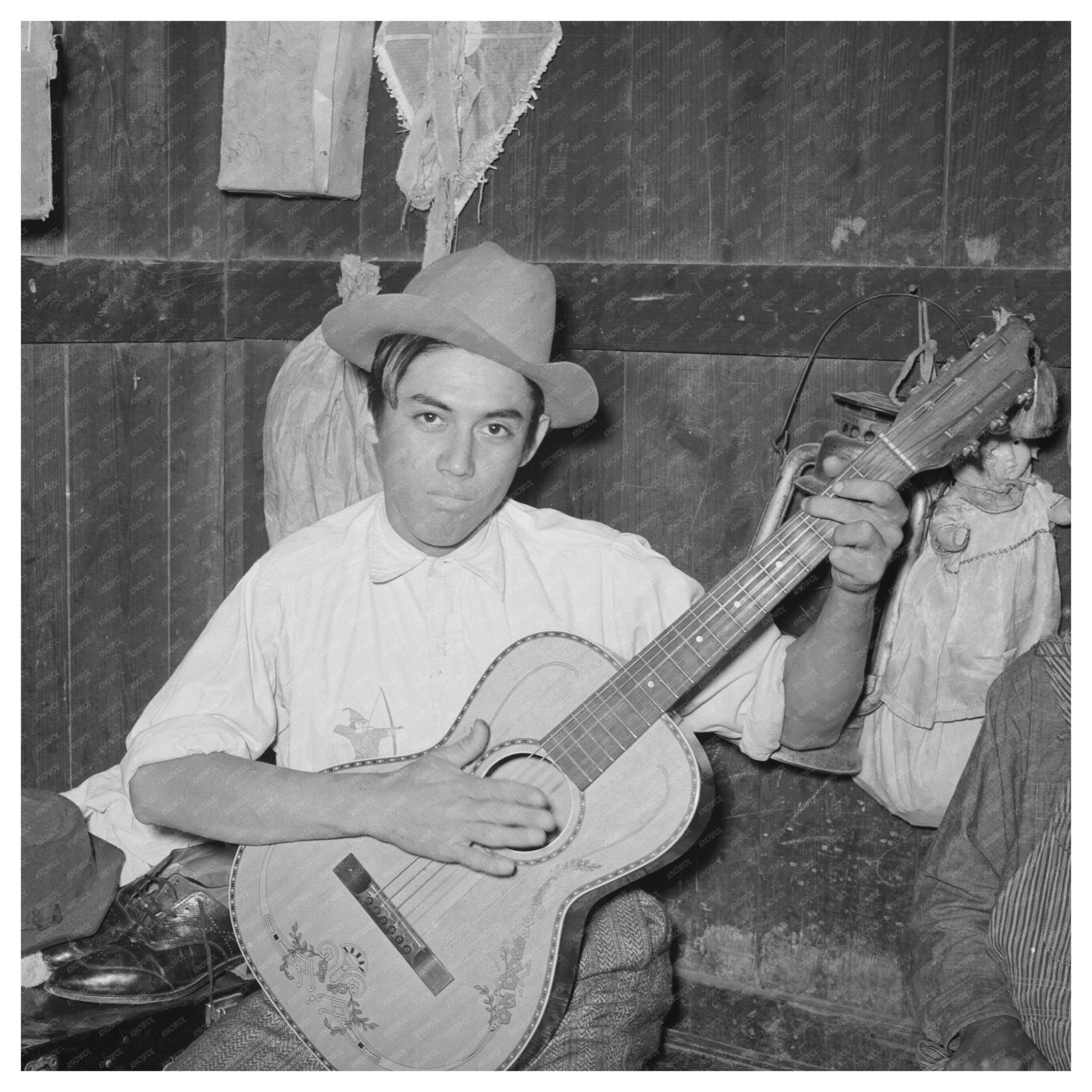 Mexican Boy Playing Guitar in Robstown Texas 1939 - Available at KNOWOL