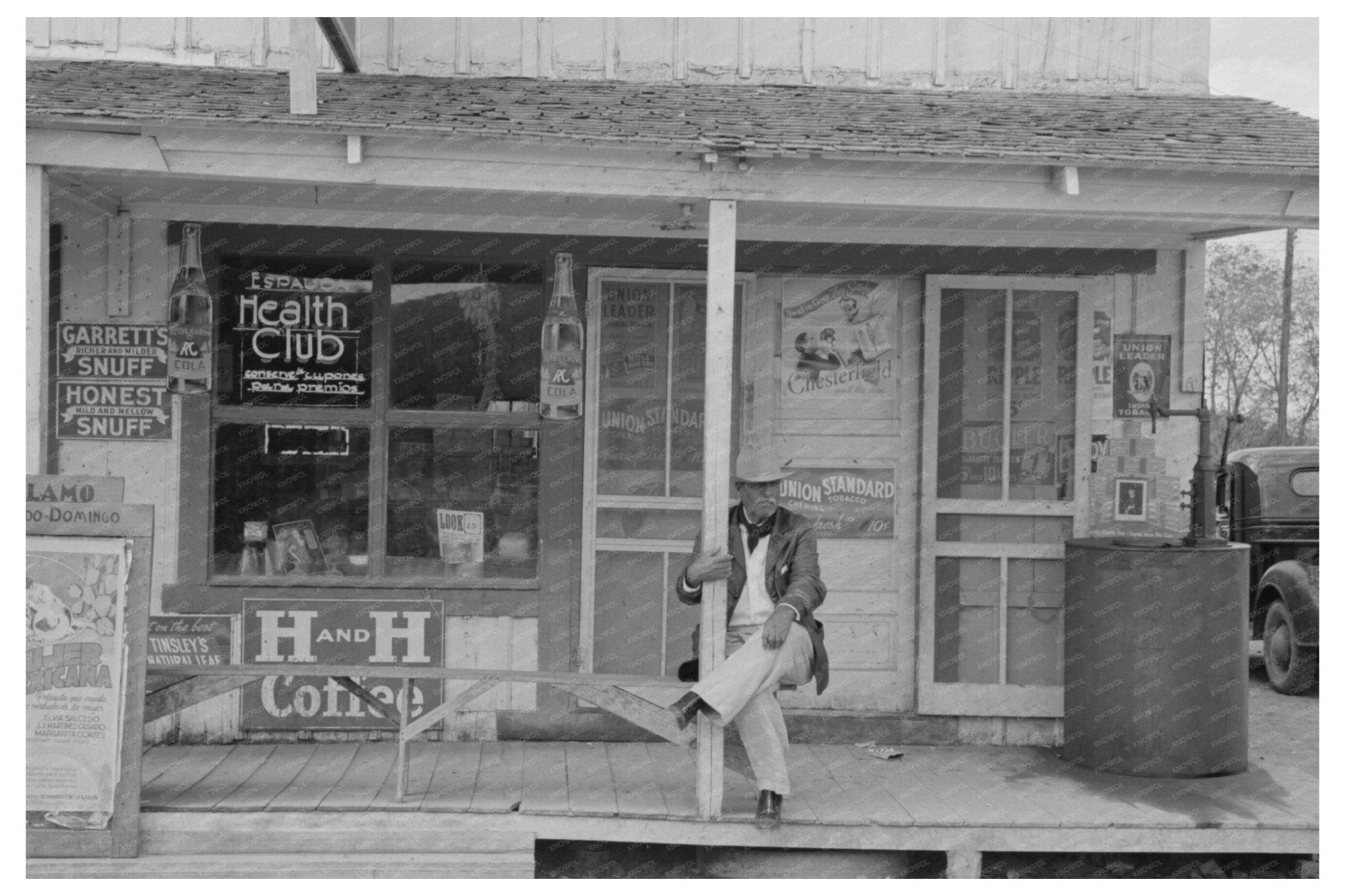 Mexican Man on Store Porch Alamo Texas February 1939 - Available at KNOWOL