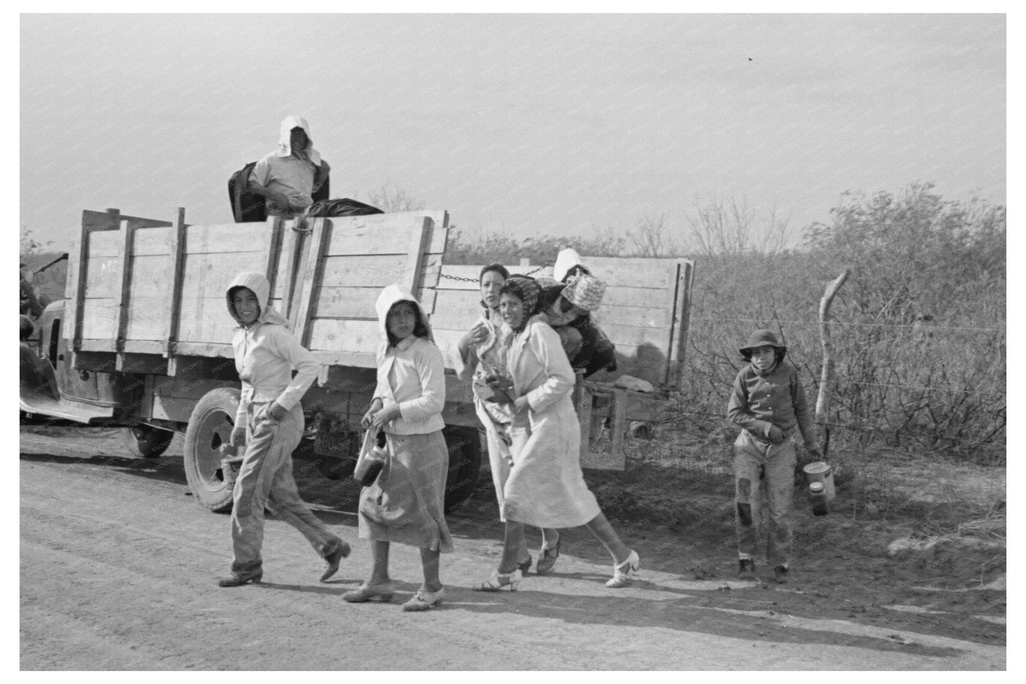 Mexican Women Disembarking Truck La Pryor Texas 1939 - Available at KNOWOL