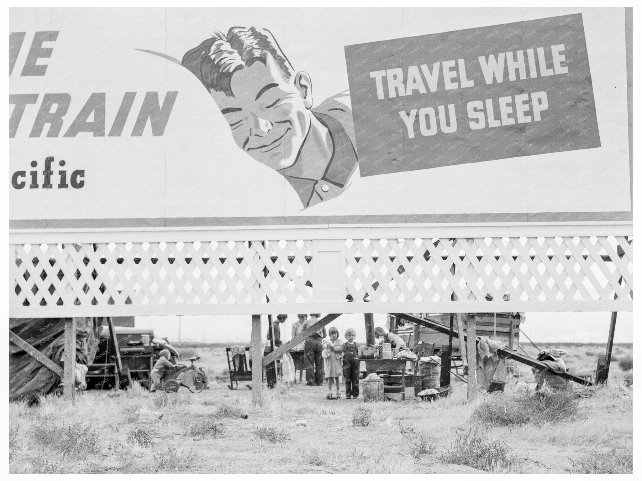 Migrant Families Camped Behind Billboard November 1938 - Available at KNOWOL