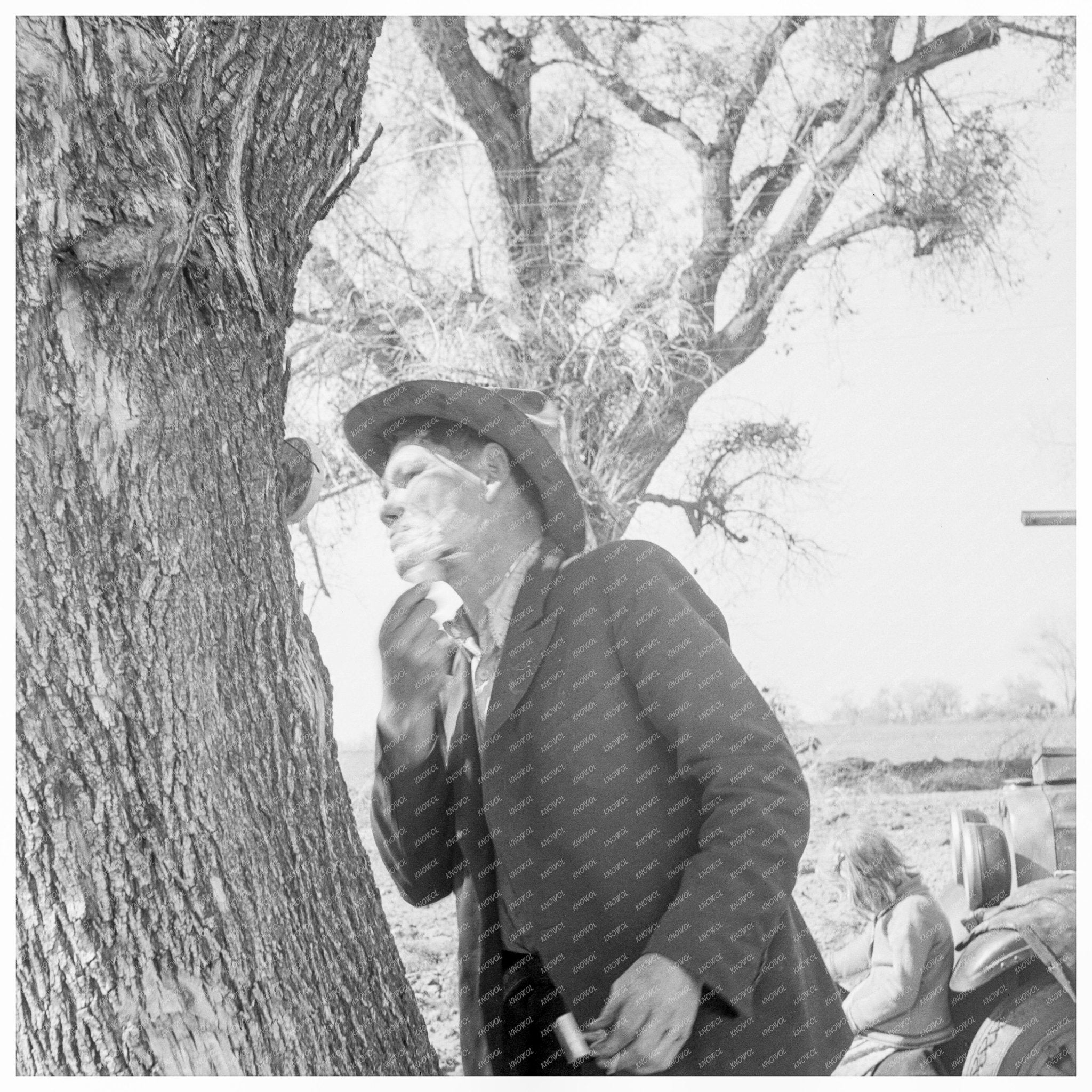 Migrant Man Shaving by Roadside U.S. 99 February 1939 - Available at KNOWOL