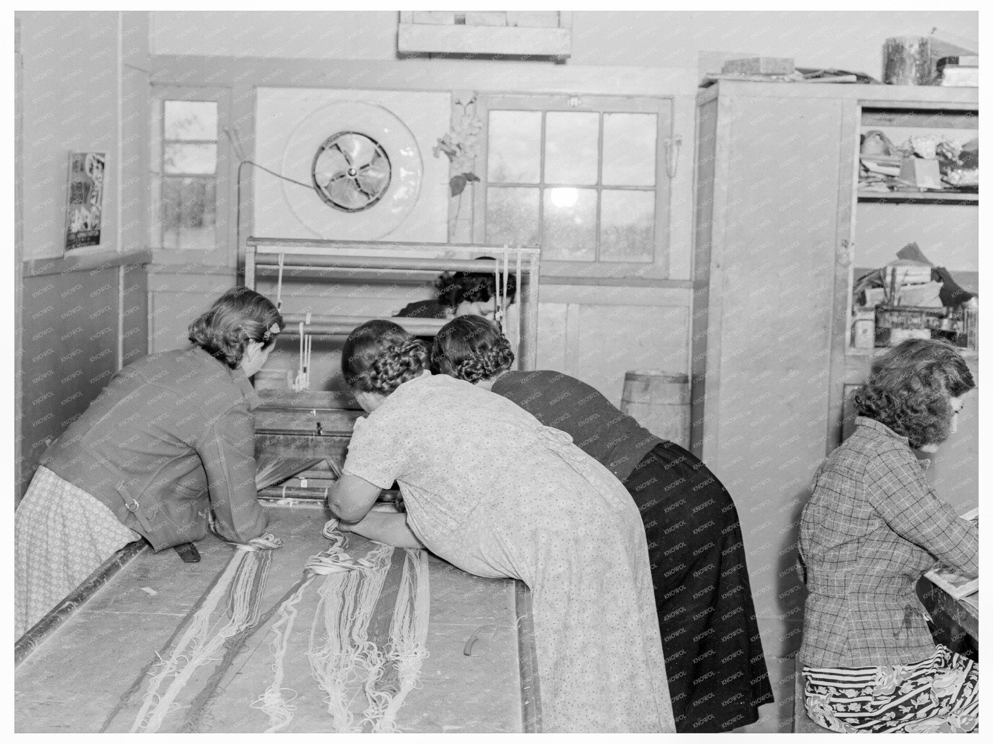 Migrant Women Sewing Rugs at Shafter Camp 1938 - Available at KNOWOL