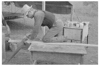 Migrant Worker Sawing Wood in Harlingen Texas 1939 - Available at KNOWOL