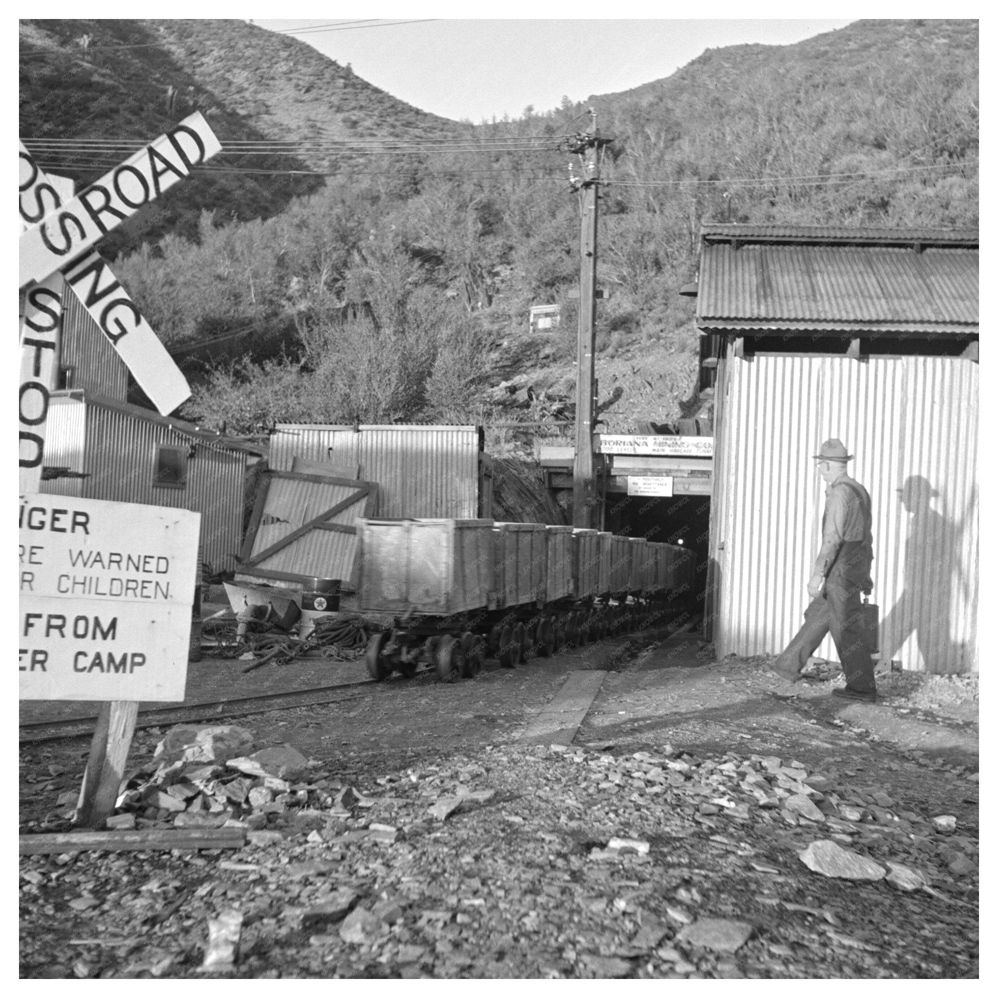 Miner Approaching Train of Tungsten Ore Cars Arizona 1940 - Available at KNOWOL