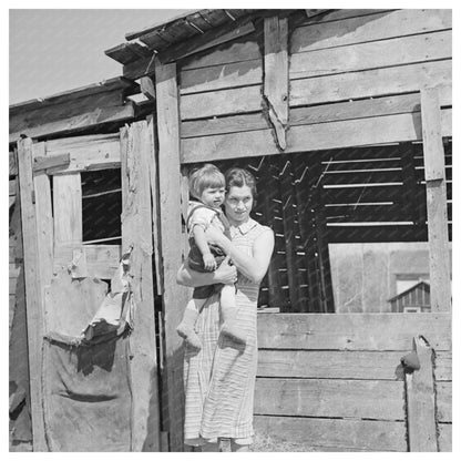 Mother and Child Outside Woodshed Gibbs City Michigan 1937 - Available at KNOWOL