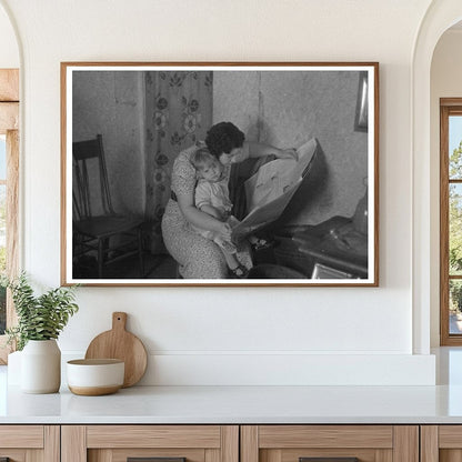 Mother Reading Newspaper with Child in Nissen Shack 1936 - Available at KNOWOL