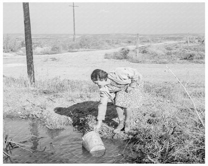 Mrs. Bartheloma Drawing Water in Nyssa Heights 1939 - Available at KNOWOL