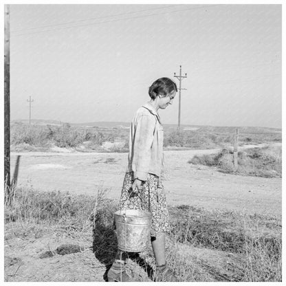 Mrs. Bartheloma Hauling Water Nyssa Heights Oregon 1939 - Available at KNOWOL